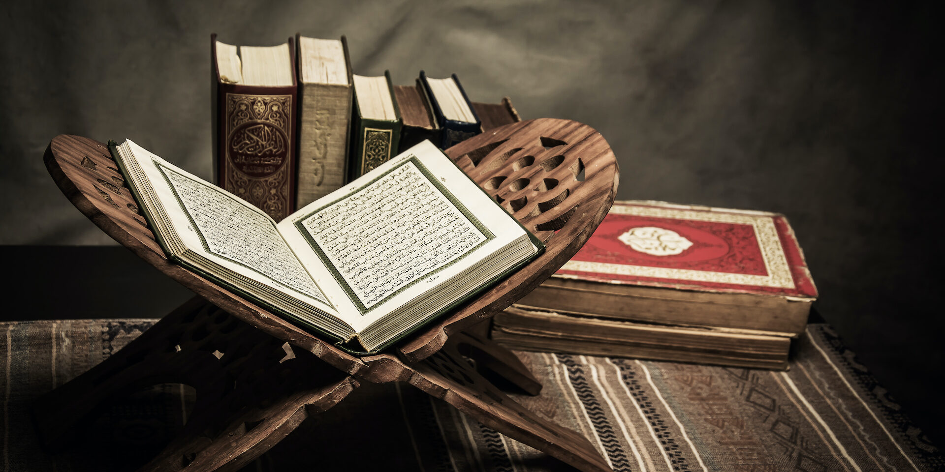 Koran – holy book of Muslims ( public item of all muslims ) on the table , still life
